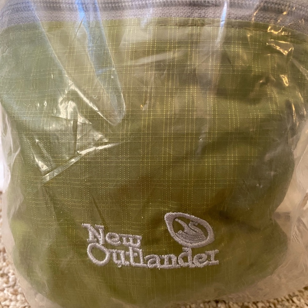 Packable lightweight hiking/travel backpack. Green, still in original packaging.